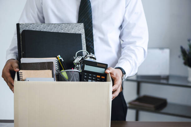 Personal items packed in a box representing severance and departure